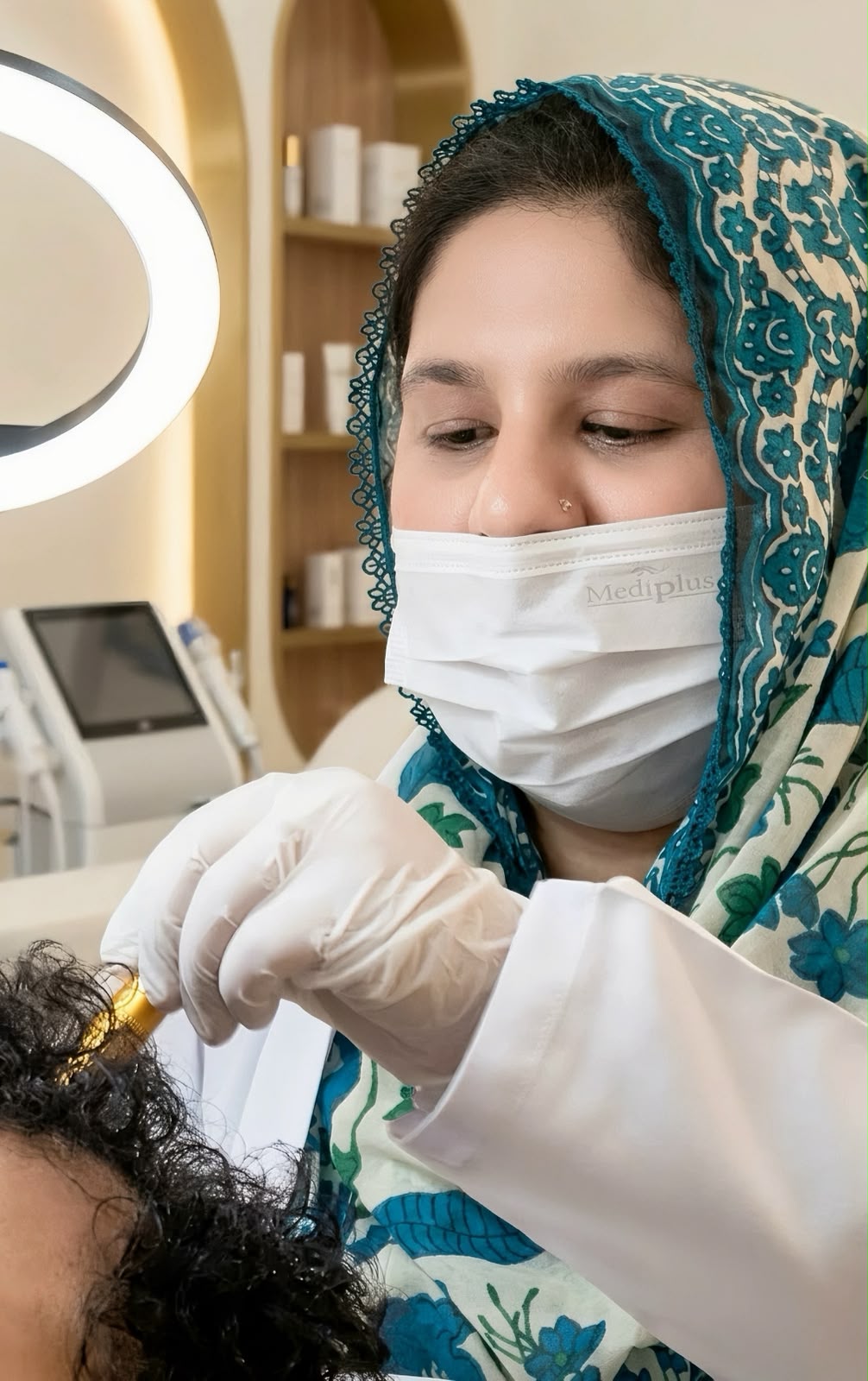 Dr. Momna Arooj performing an advanced aesthetic treatment at Elaj Skin and Aesthetic in Gujranwala